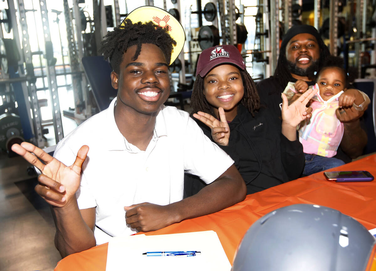 Bishop Gorman High School football player Jonathan Brady poses for a photo with his sisters Jai ...