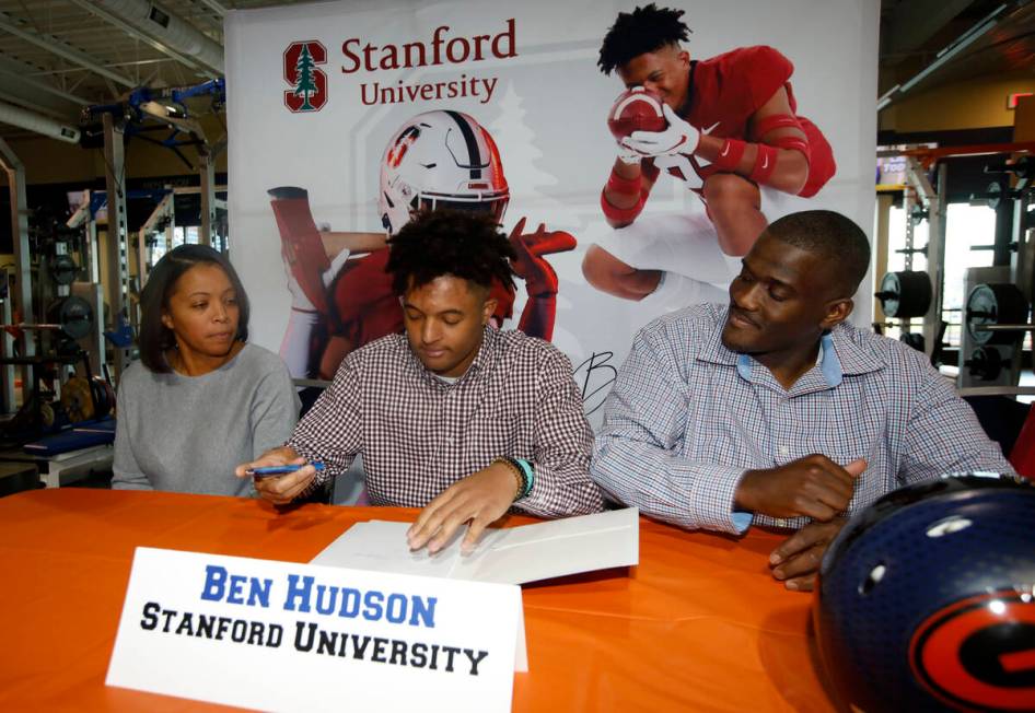 Bishop Gorman High School football player Benjamin Hudson, center, signs with Stanford Universi ...