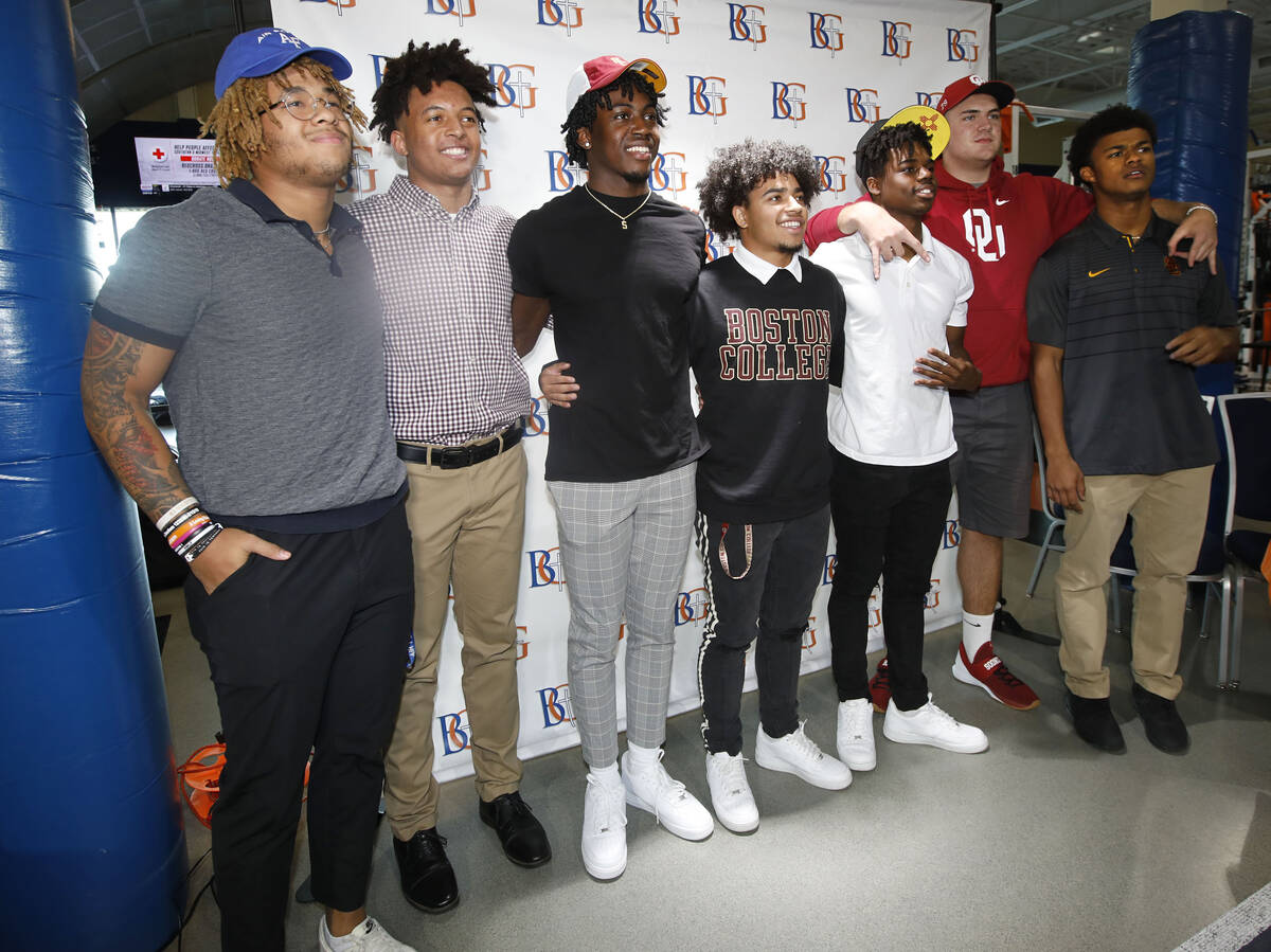 Bishop Gorman High School football players Jeremiah-Joseph 'JJ' Bwire, from left, Benjamin Huds ...