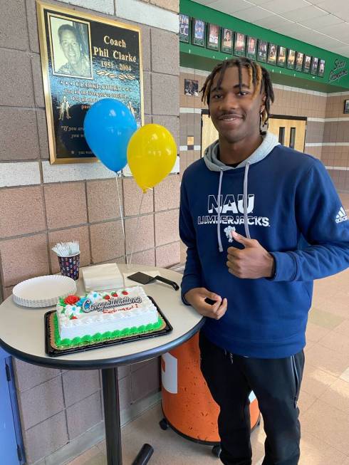 Palo Verde's Edward Rhambo celebrates after signing to play football at Northern Arizona on Wed ...