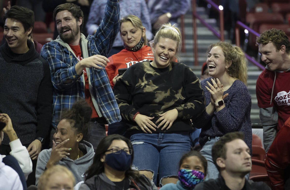 UNLV fans cheer for the Rebels in the second half of an NCAA mens basketball game against the O ...