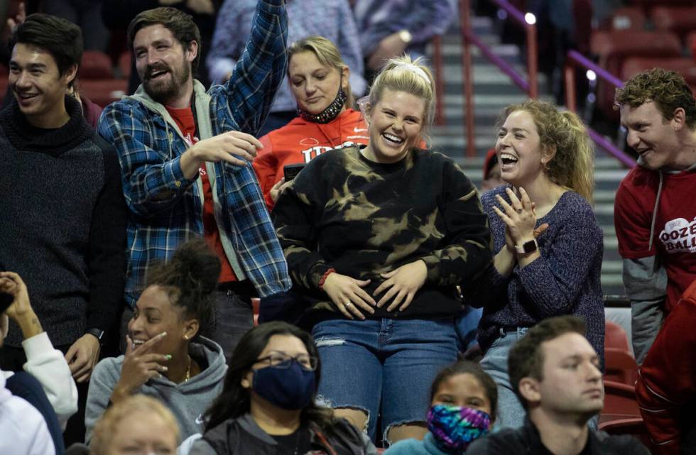 UNLV fans cheer for the Rebels in the second half of an NCAA mens basketball game against the O ...