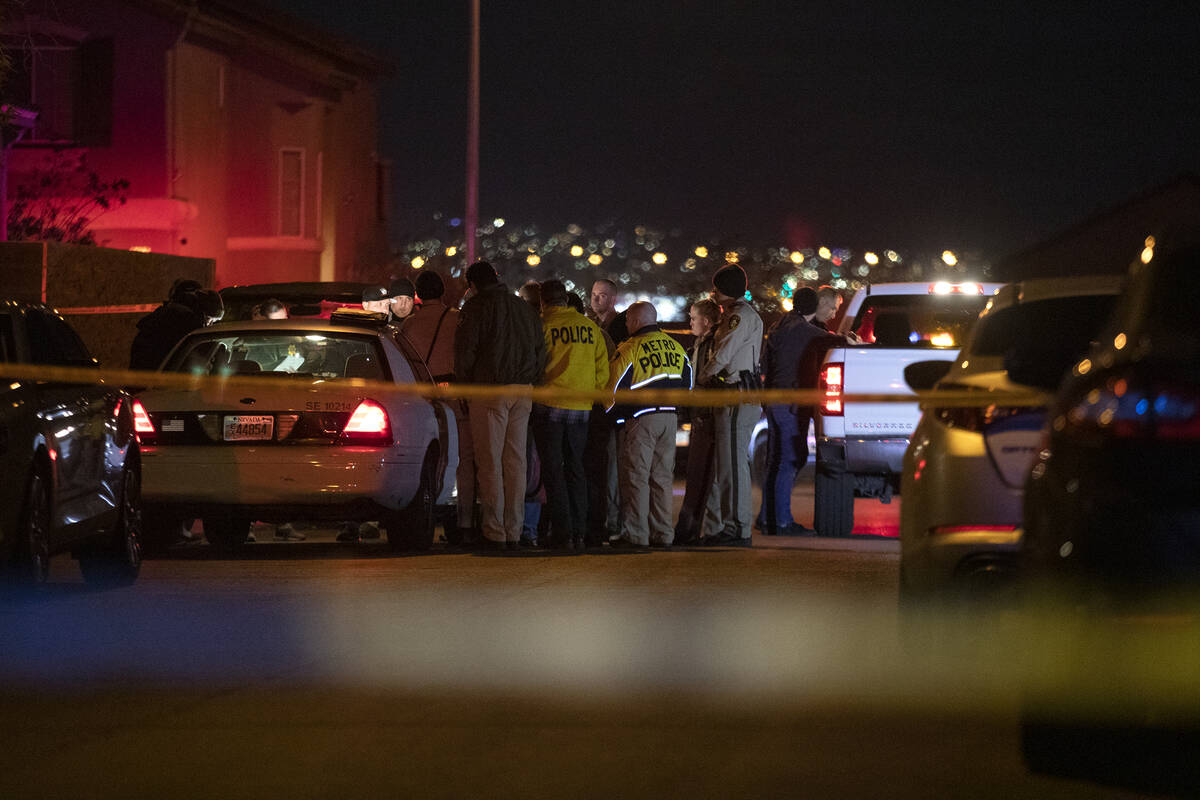 Metropolitan police investigate a homicide in the 5000 block of Sagelyn Street, near Tropicana ...