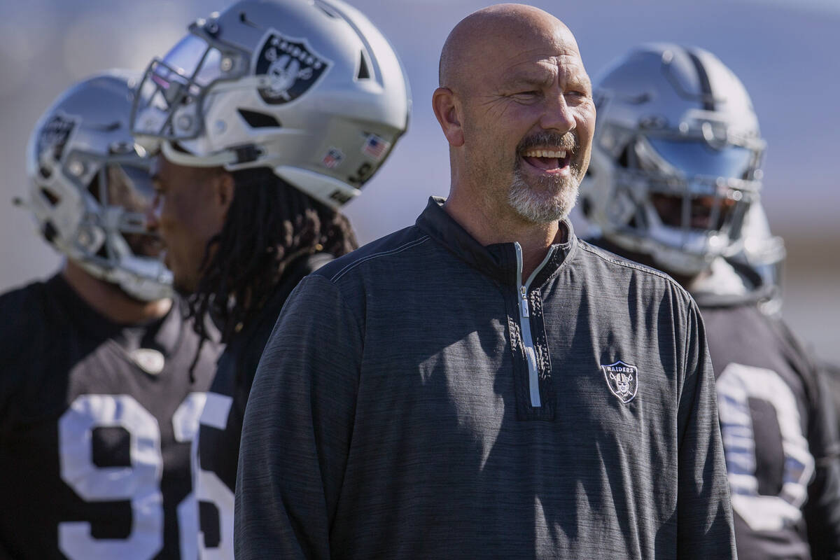 Raiders defensive coordinator Gus Bradley coaches the defensive line during practice at Raiders ...