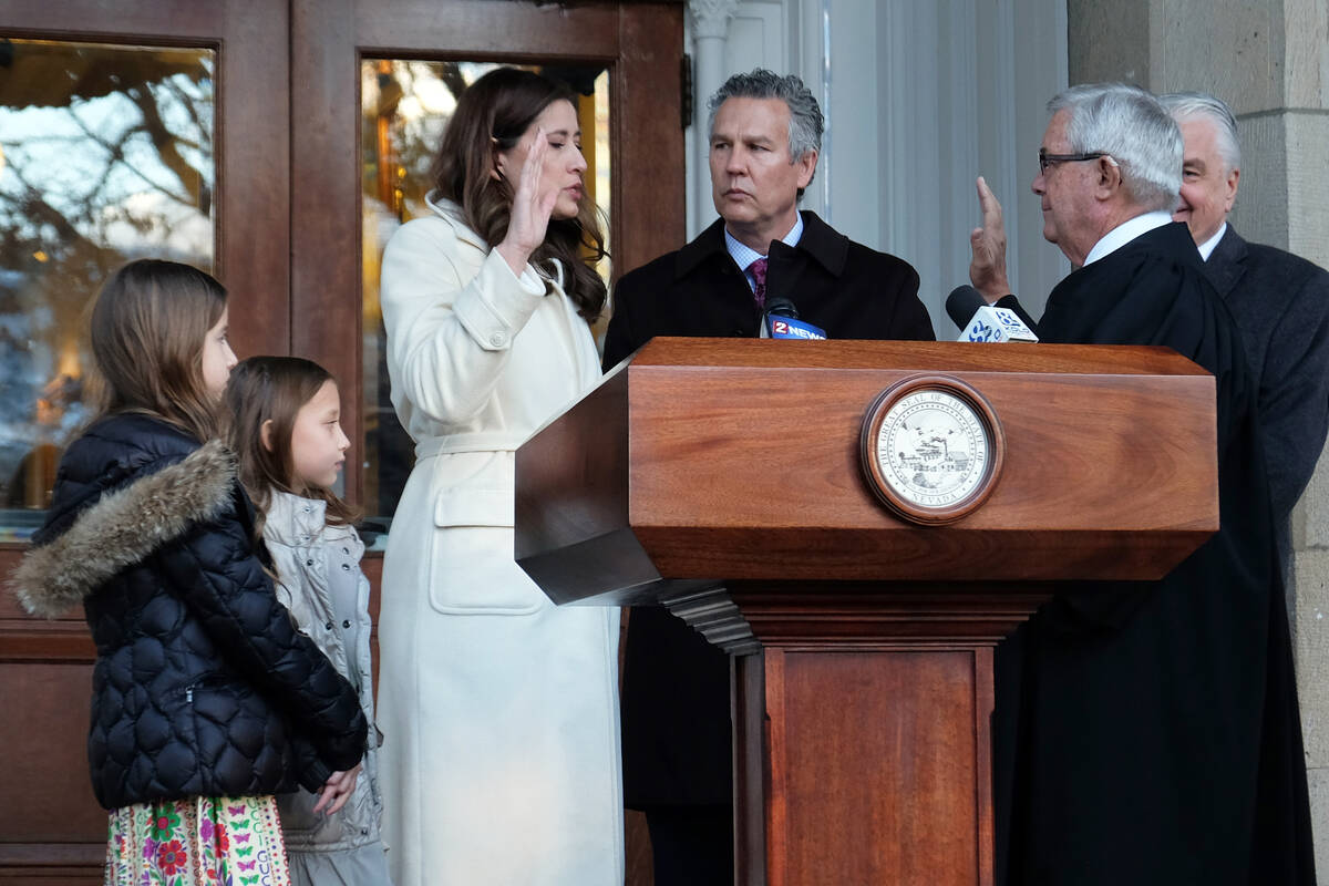 Lisa Cano Burkhead is sworn in as Nevada's lieutenant governor by Supreme Court Chief Justice J ...