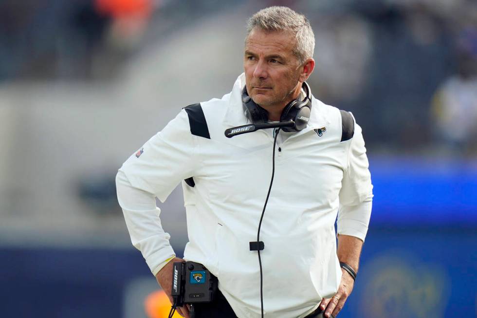 Jacksonville Jaguars head coach Urban Meyer stands on the field before an NFL football game aga ...