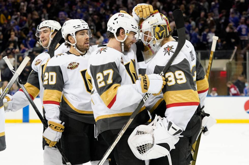 Vegas Golden Knights goaltender Laurent Brossoit (39) celebrates with his teammates after the V ...