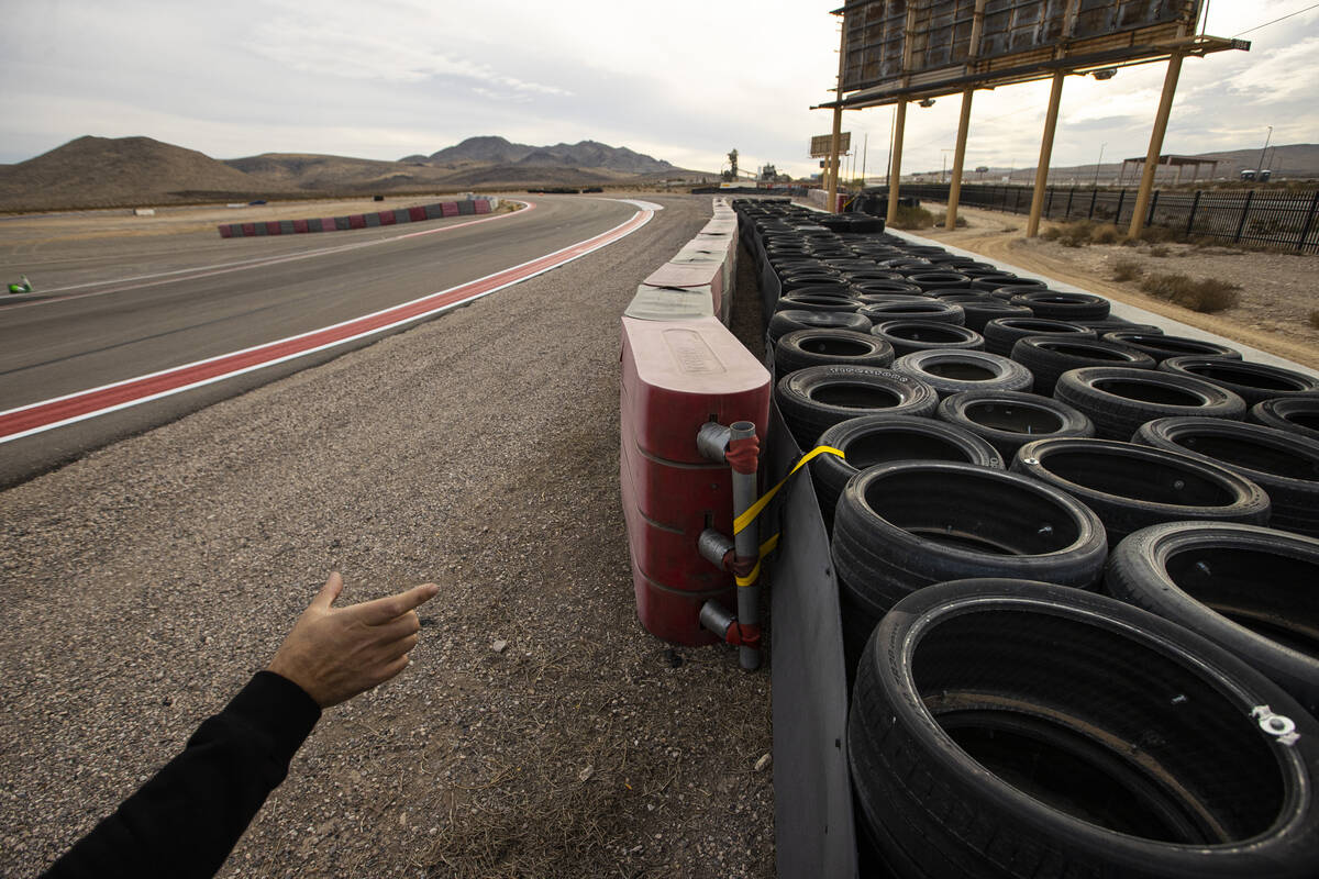 Romain Thievin, co-founder and co-CEO of Exotics Racing, points out the layers of the safety ba ...