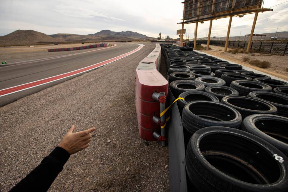 Romain Thievin, co-founder and co-CEO of Exotics Racing, points out the layers of the safety ba ...