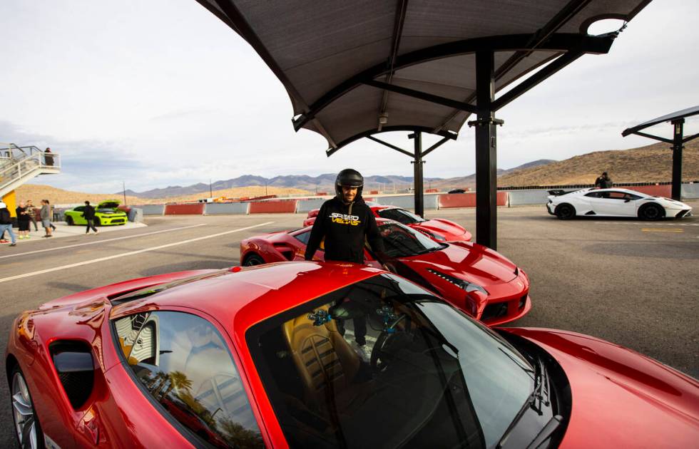 Romain Thievin, co-founder and co-CEO of Exotics Racing, opens the door of a Ferrari 488 GTB at ...