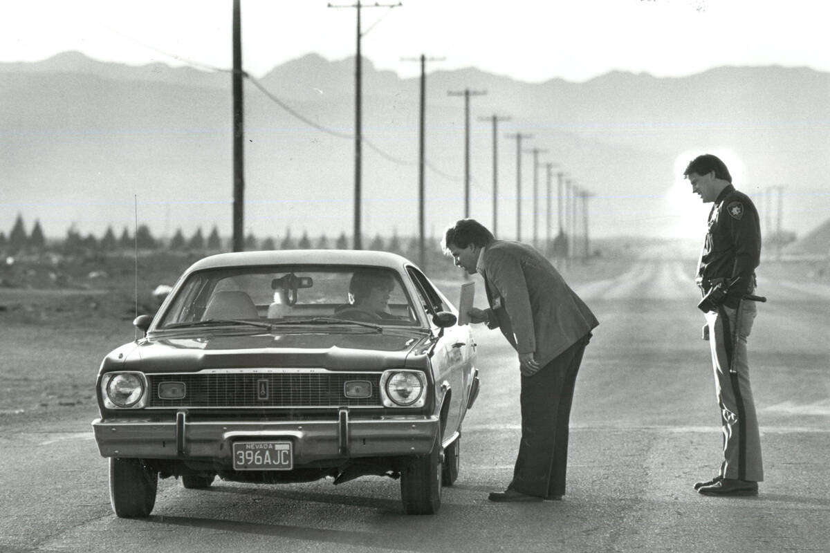 Metropolitan police officers Michael Hope and Larry Spinosa stop a motorist along West Spring M ...