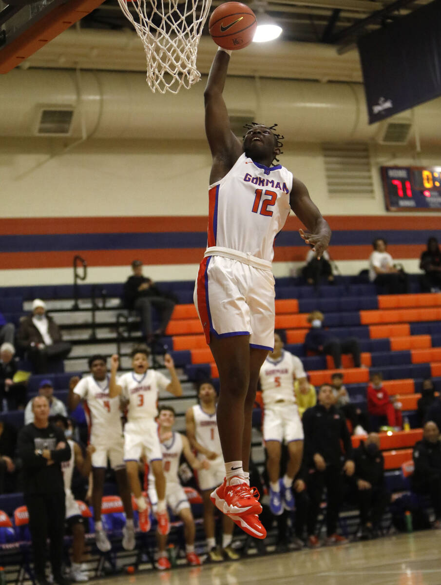 Bishop Gorman High School's Anthony Nwuli (12) goes to the basket in the second half of a Tarka ...