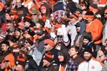A fan holds a Baker Mayfield cutout during an NFL football game against the Baltimore Ravens, S ...