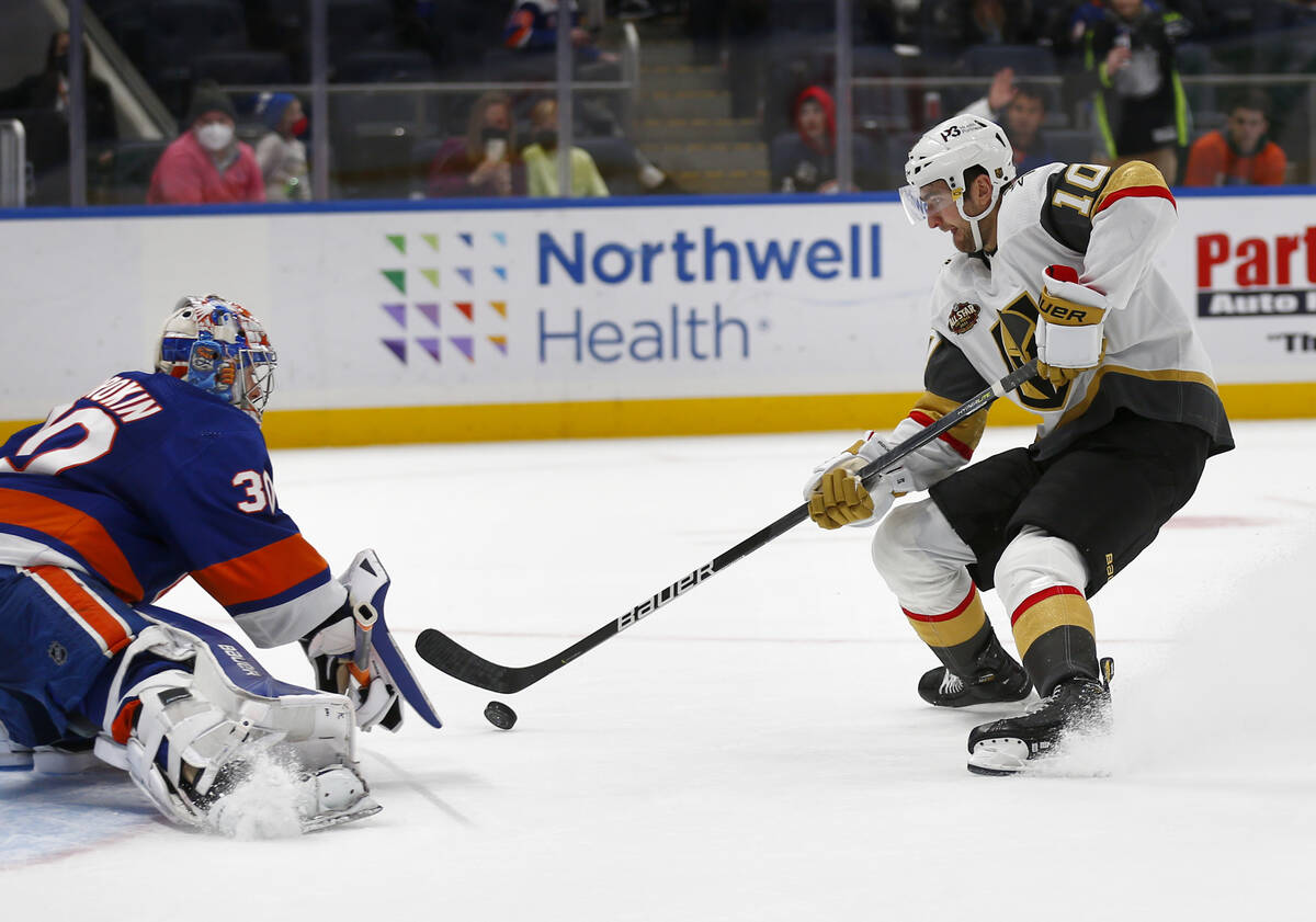 Vegas Golden Knights' Nicolas Roy (10) scores the winning penalty shot past New York Islanders' ...