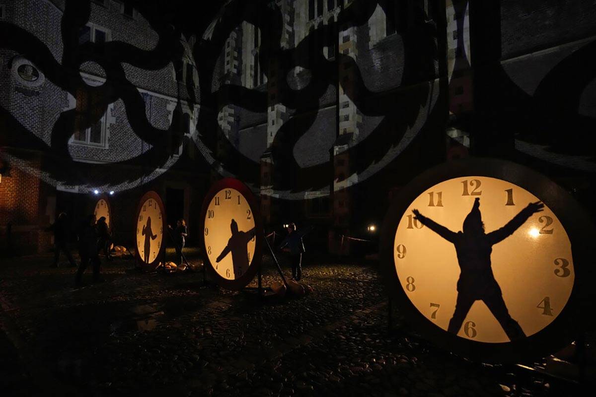 Visitors interact with clock lighting on the "Palace of Stardust" light trail held fo ...