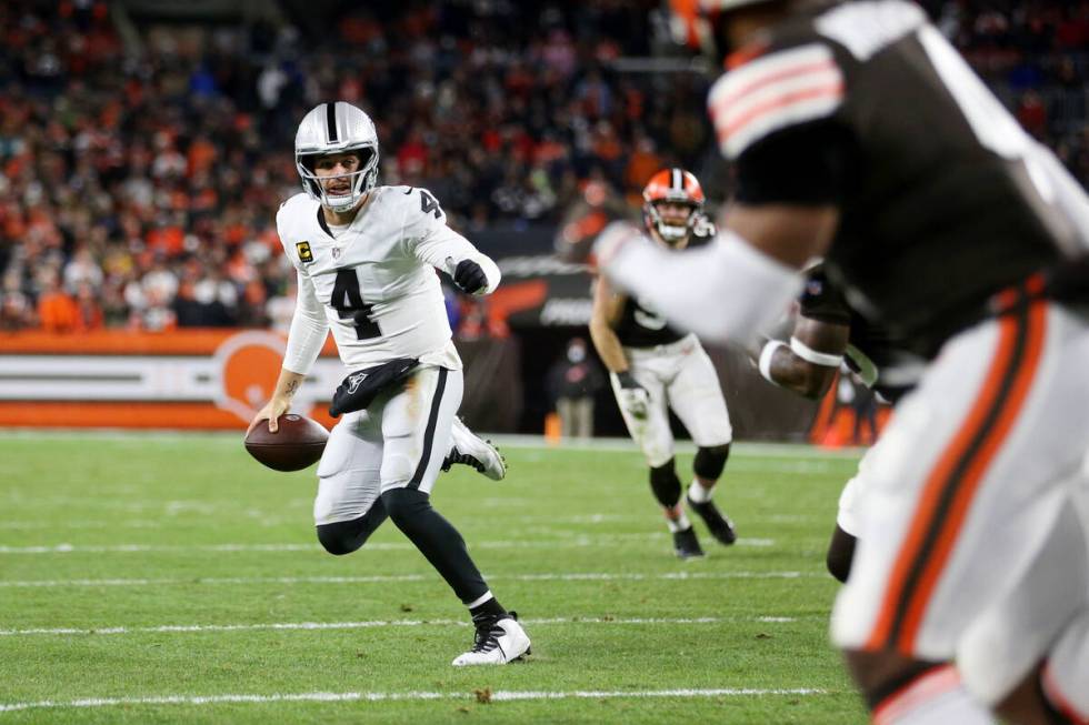 Raiders quarterback Derek Carr (4) looks for an open pass during the first half of an NFL footb ...