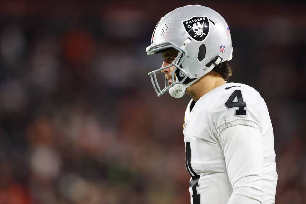 Raiders quarterback Derek Carr (4) walks the field during the first half of an NFL football gam ...