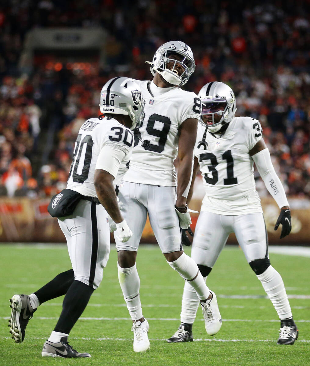 Raiders wide receiver Bryan Edwards (89) celebrates a touchdown catch with =running back Jalen ...