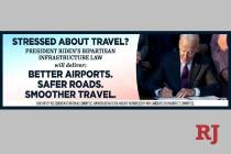 A billboard paid for by the Democratic National Committee and featuring President Joe Biden sig ...