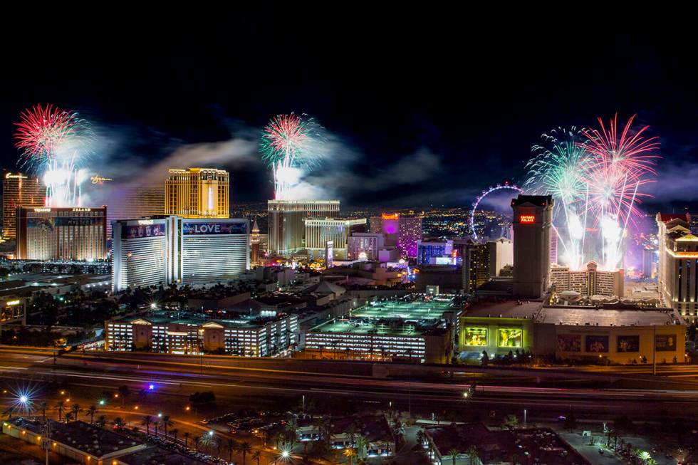 Fireworks for New Year's Eve erupt over the Strip as viewed from the VooDoo Rooftop Nightclub & ...