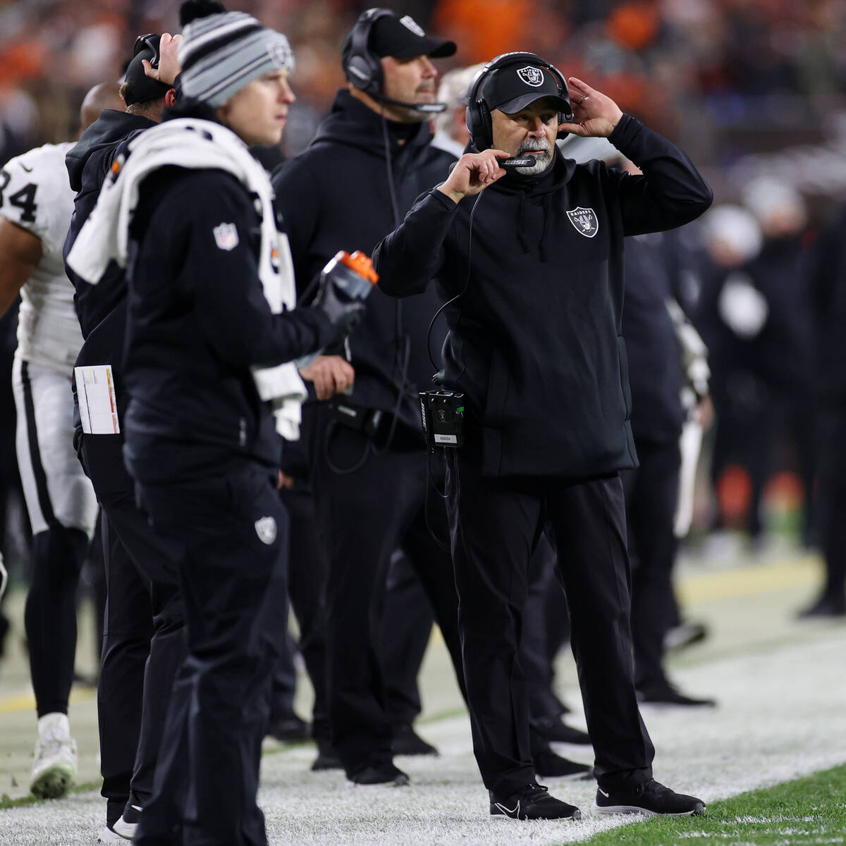 Raiders interim head coach Rich Bisaccia watches his team from the sideline during the second h ...