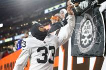 Raiders safety Roderic Teamer (33) celebrates his team's win win fans after an NFL football gam ...