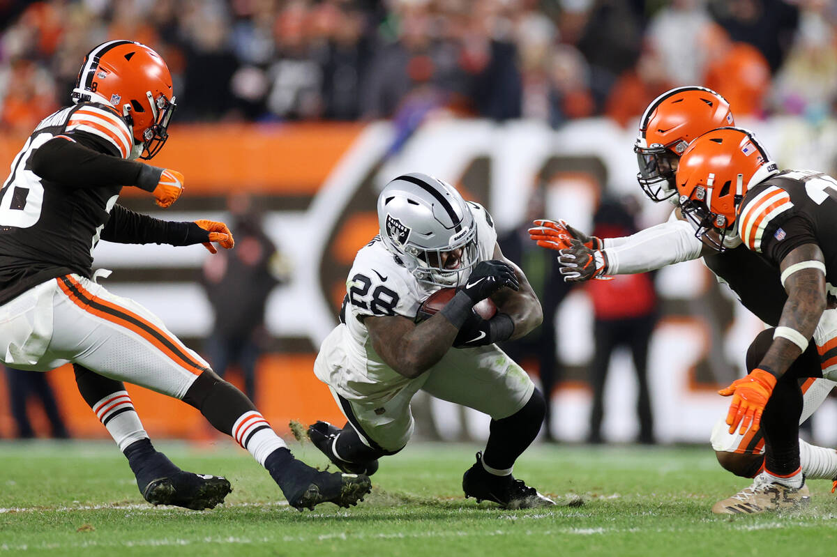 Raiders running back Josh Jacobs (28) runs the ball against the Cleveland Browns during the sec ...
