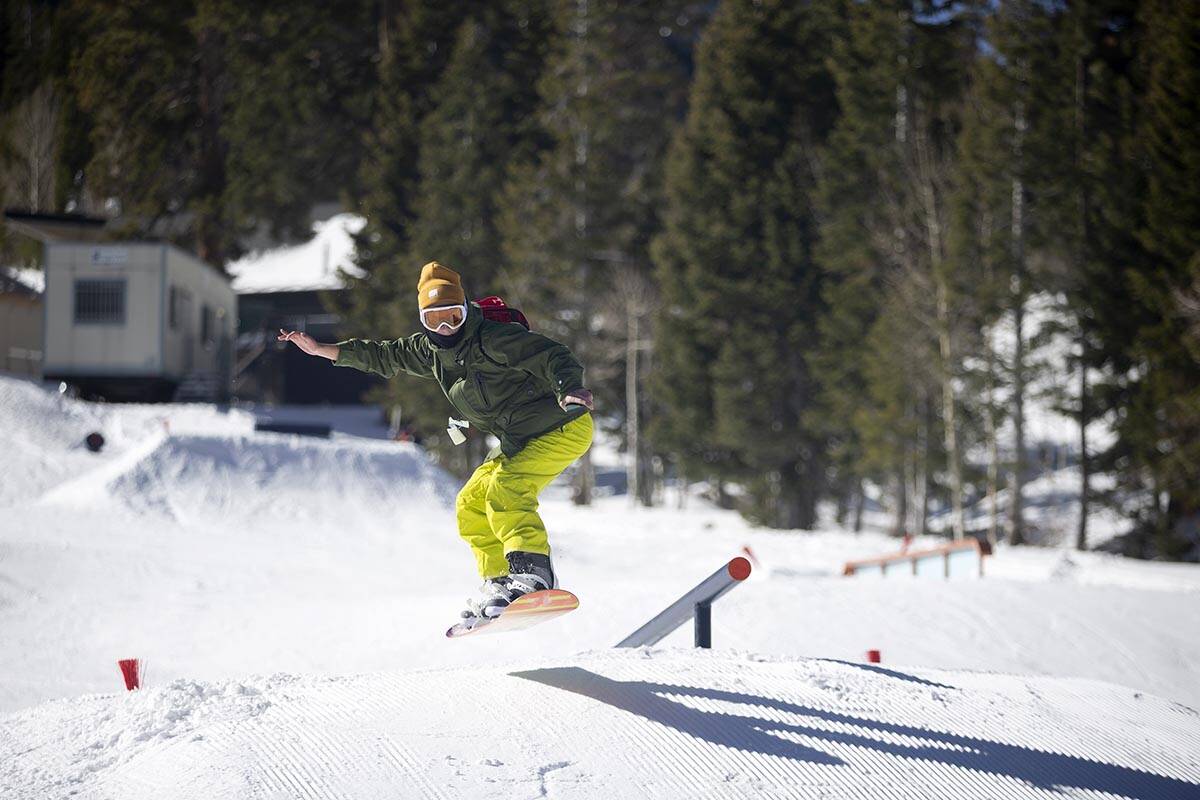 A snowboarder catches air on Rabbit Peak during opening day on Dec. 17, 2021, at the Lee Canyon ...