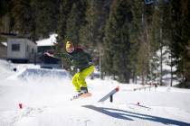 A snowboarder catches air on Rabbit Peak during opening day on Dec. 17, 2021, at the Lee Canyon ...