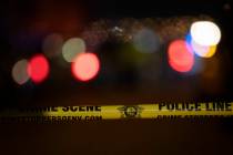 Police tape cordons off the crime scene of a homicide in the 5000 block of Sagelyn Street, nea ...
