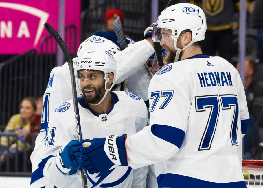 Tampa Bay Lightning left wing Pierre-Edouard Bellemare (41) celebrates with teammates after bea ...