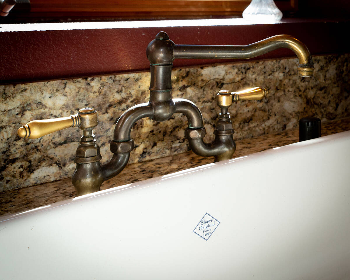 The farm sink has a weathered bronze faucet. (Tonya Harvey/Real Estate Millions)