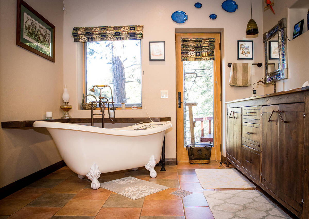 The spa-like bath features a walk-in shower with tile surround, double vanity and exquisite cla ...
