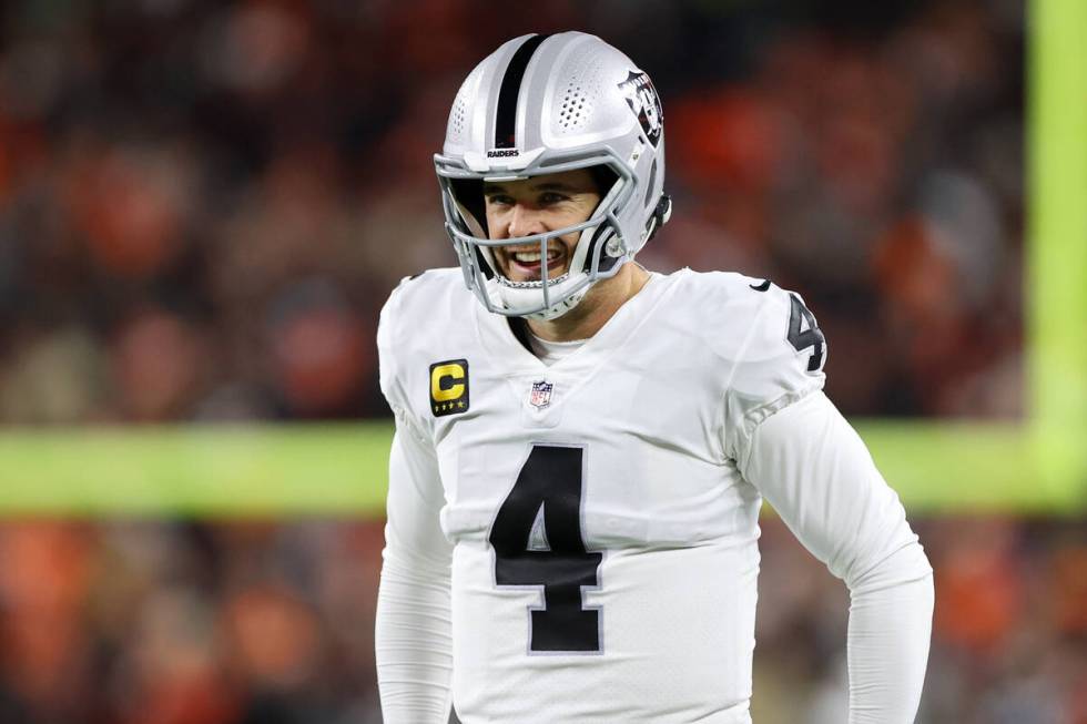 Raiders quarterback Derek Carr (4) walks the field during the first half of an NFL football gam ...