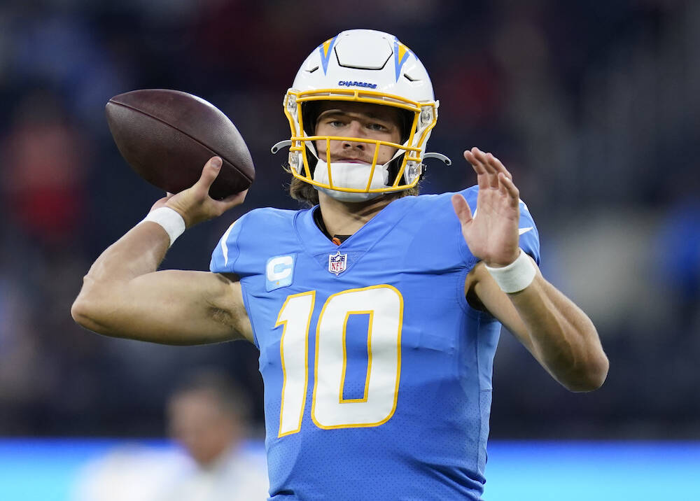 Los Angeles Chargers quarterback Justin Herbert (10) throws a pass during an NFL football game ...