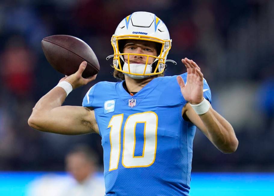 Los Angeles Chargers quarterback Justin Herbert (10) throws a pass during an NFL football game ...