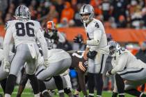 Raiders quarterback Derek Carr (4) calls a play on the line of scrimmage during the fourth quar ...
