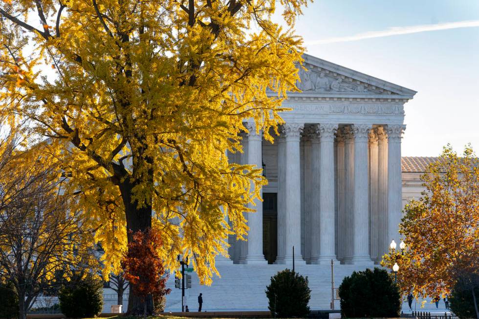 FILE - Light from the morning sun illuminates the Supreme Court in Washington, Friday, Dec. 3, ...