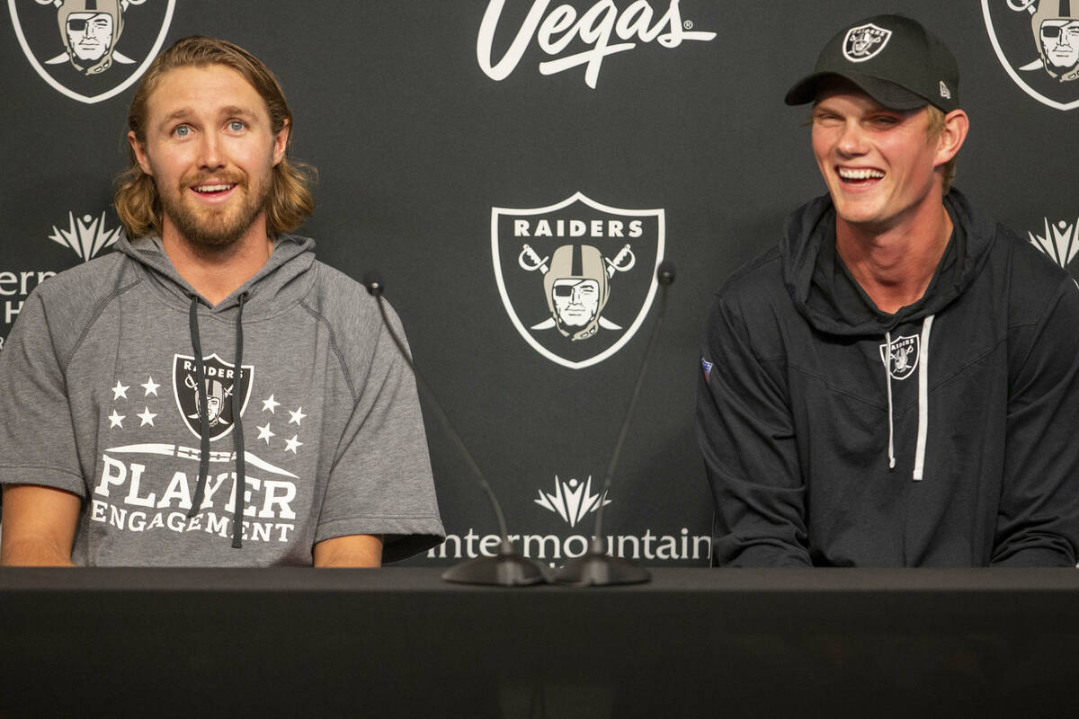 Raiders punter A.J. Cole, left, and Raiders kicker Daniel Carlson laugh during a news conferenc ...