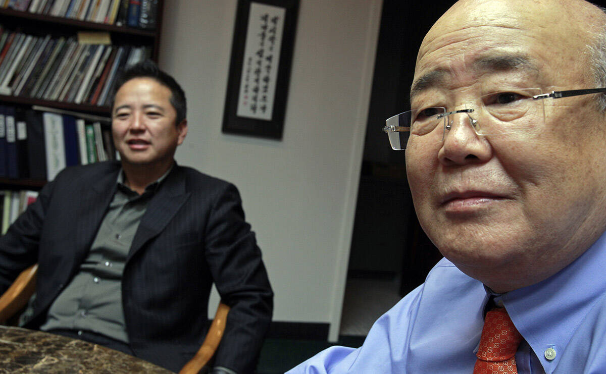 Hae Un Lee, CEO of Lee's Liquor, right, and his son Kenny Lee, president, talk about the 30th a ...