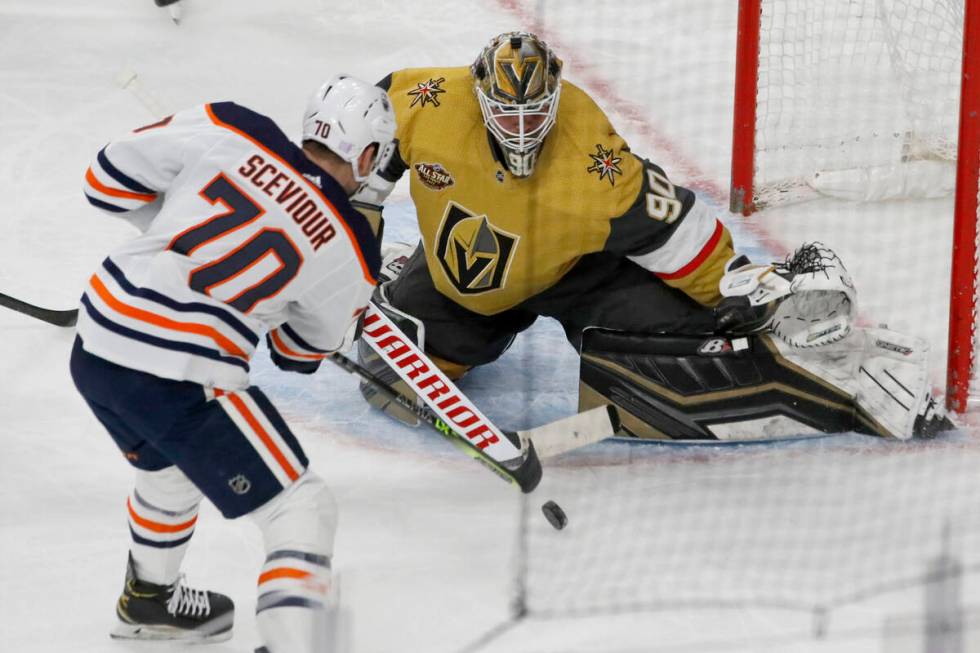 Golden Knights goaltender Robin Lehner (90) makes a save against Edmonton Oilers center Colton ...