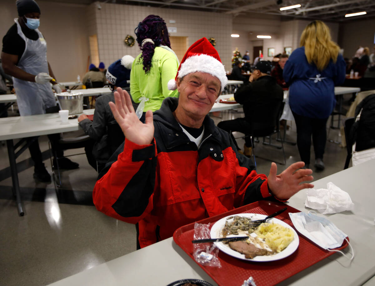 Michael Nowakowski poses for a photo, Saturday, Dec. 25, 2021, while eating during the annual C ...