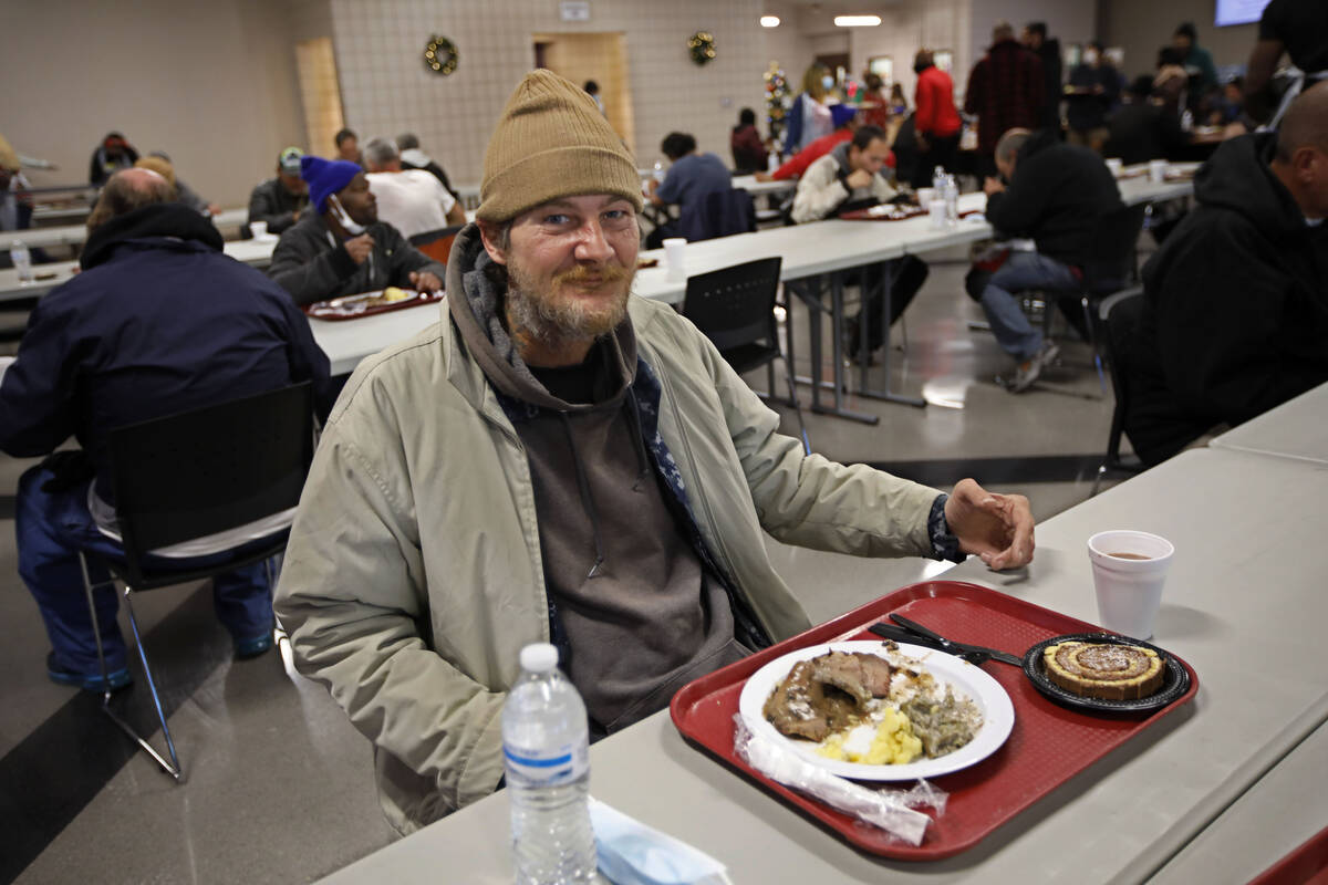 David Daughdrty poses for a photo, Saturday, Dec. 25, 2021, while eating during the annual Chr ...