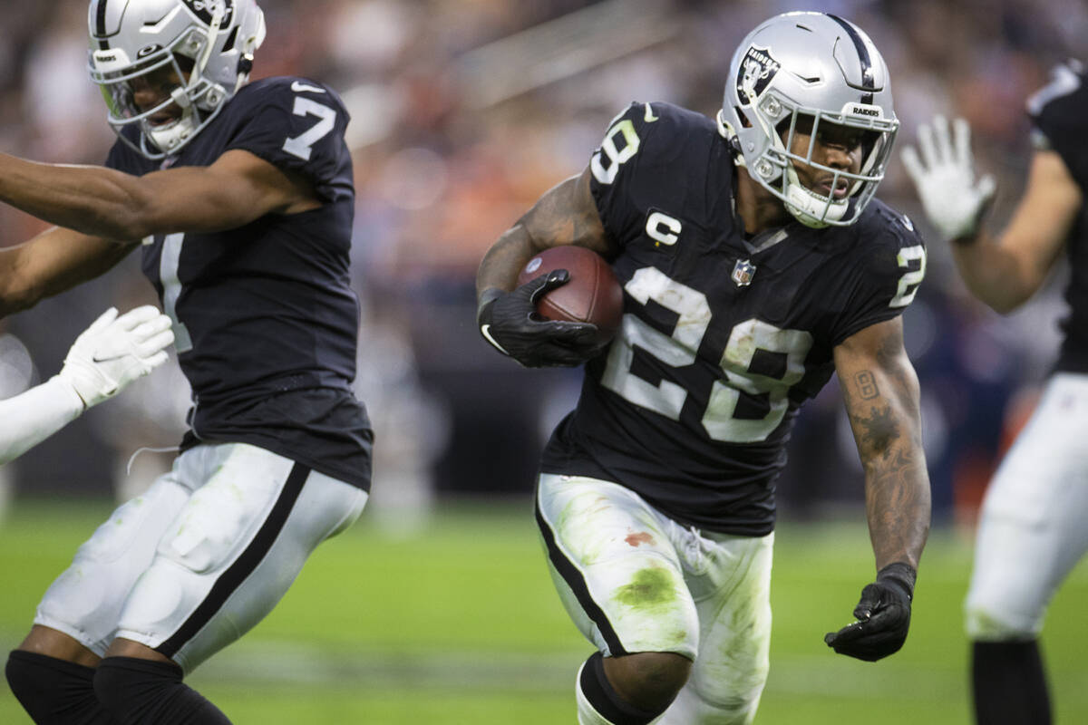 Raiders running back Josh Jacobs (28) cuts up field in the second half of an NFL football game ...