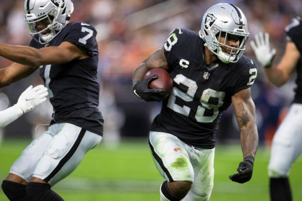 Raiders running back Josh Jacobs (28) cuts up field in the second half of an NFL football game ...