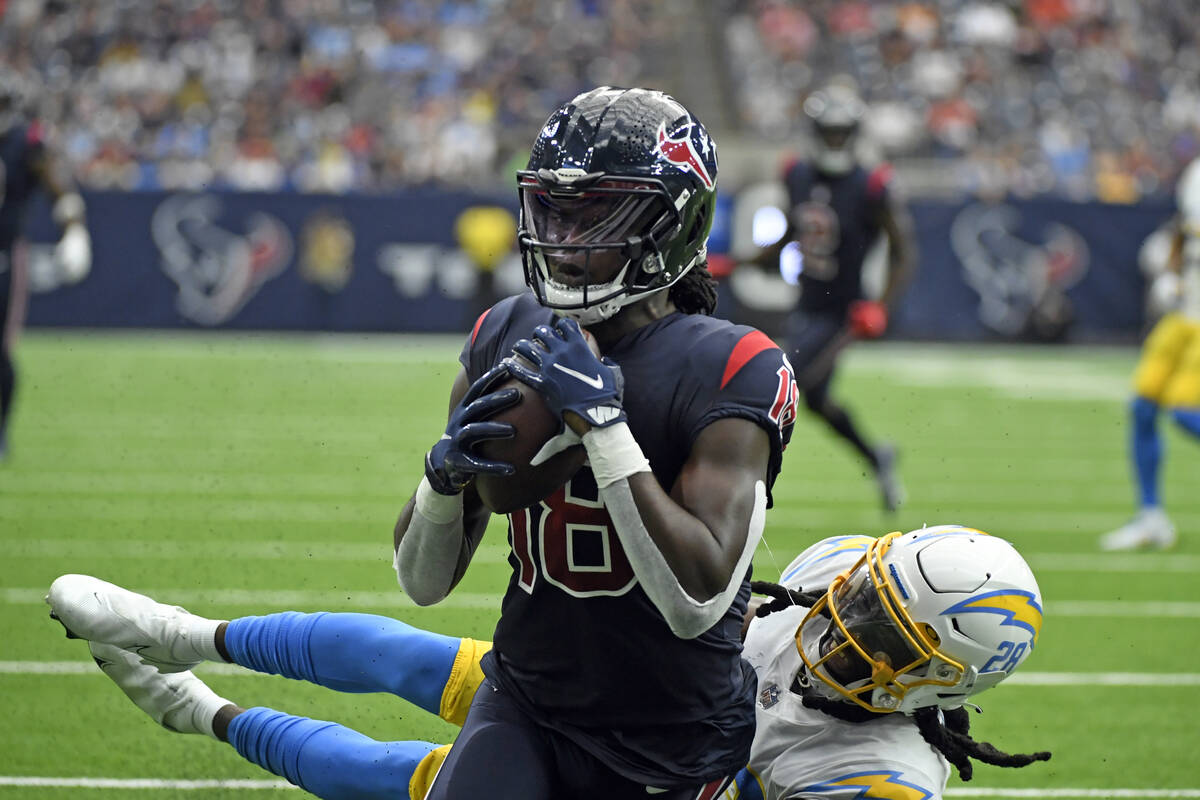 Houston Texans wide receiver Chris Conley (18) catches a pass for a touchdown as Los Angeles Ch ...