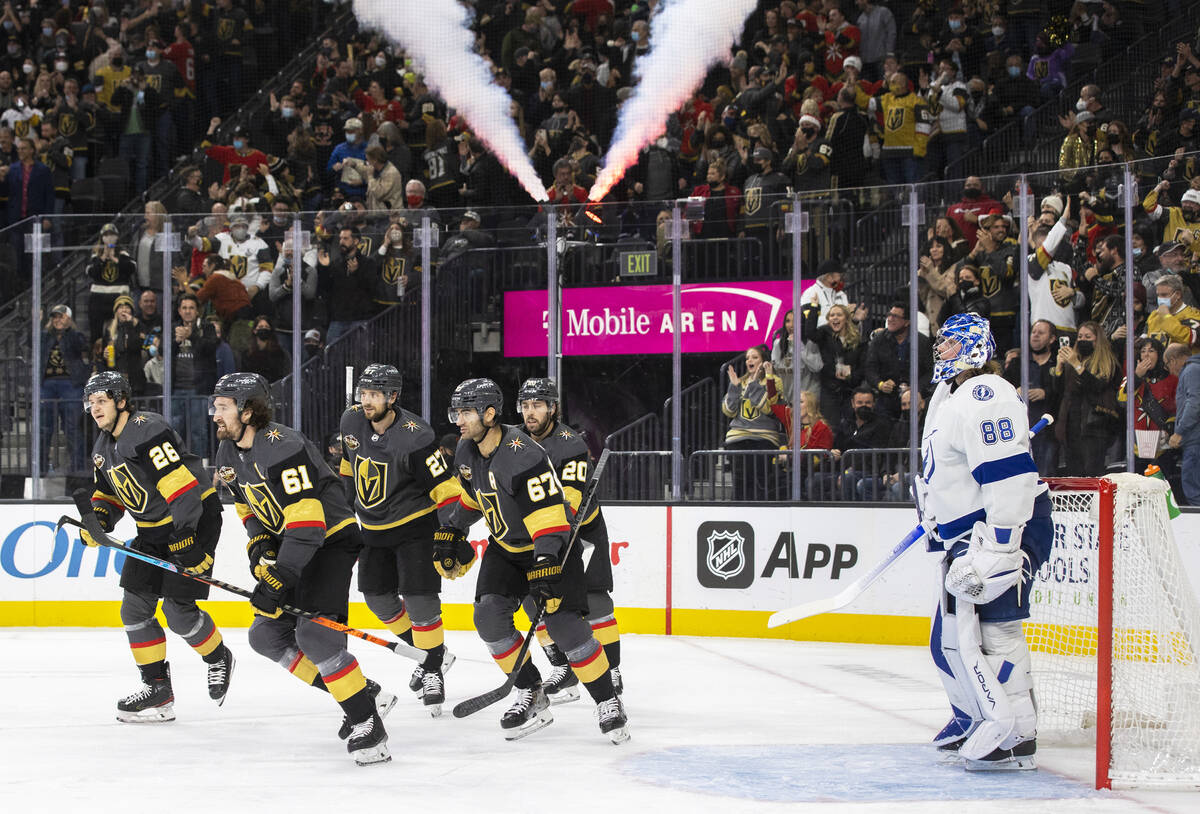 Vegas Golden Knights right wing Mark Stone (61) celebrates with teammates after scoring a goal ...