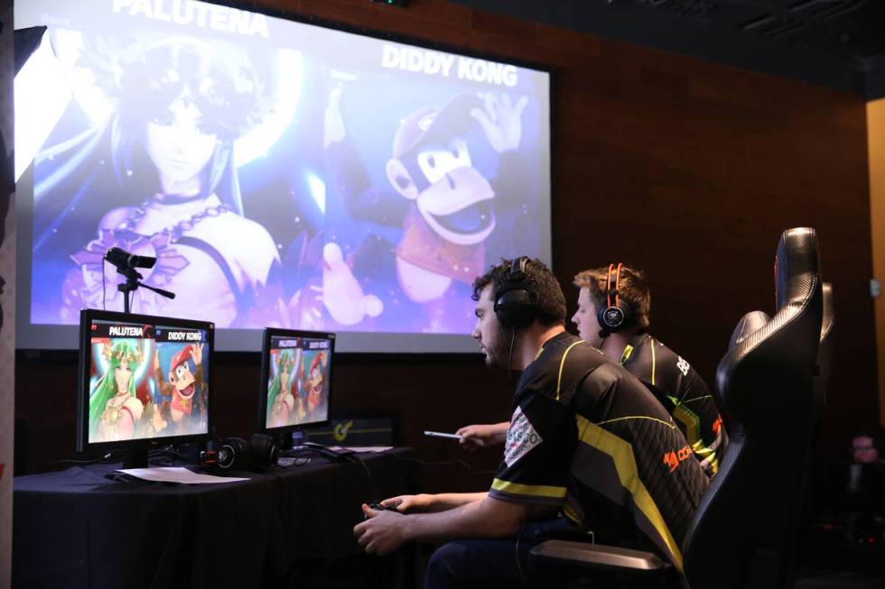 Las Vegas resident Dakota Goode, 27, center, competes in the Super Smash Bros. Ultimate Showdow ...