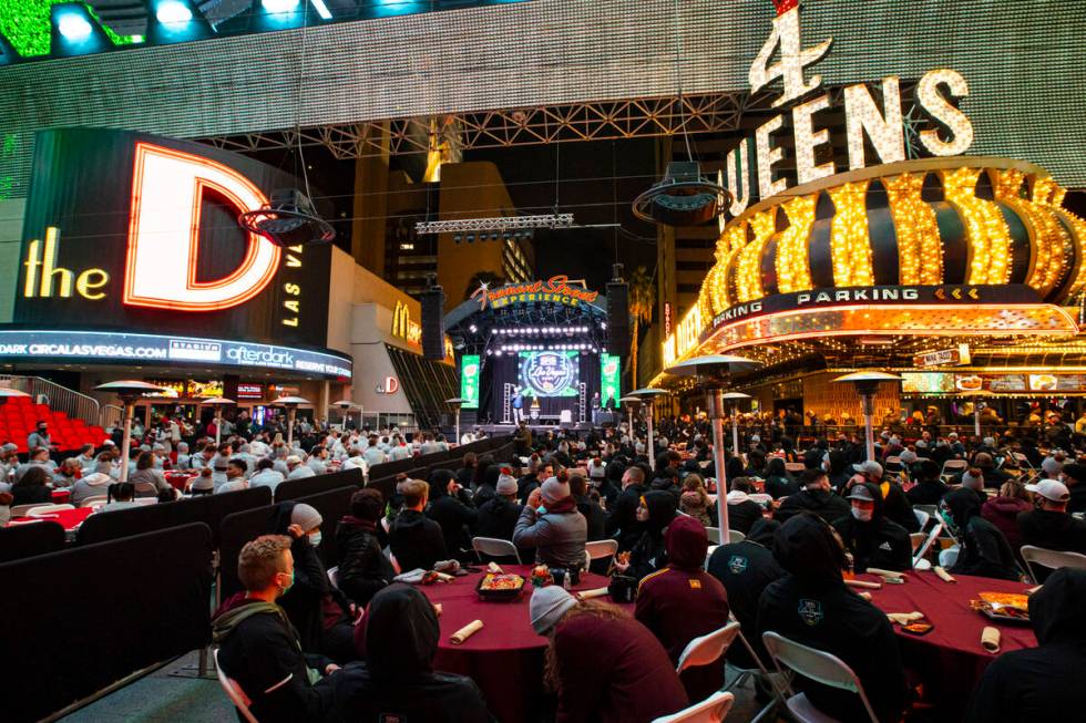 Arizona State players, right, attend a welcome reception along with Wisconsin at the Fremont St ...