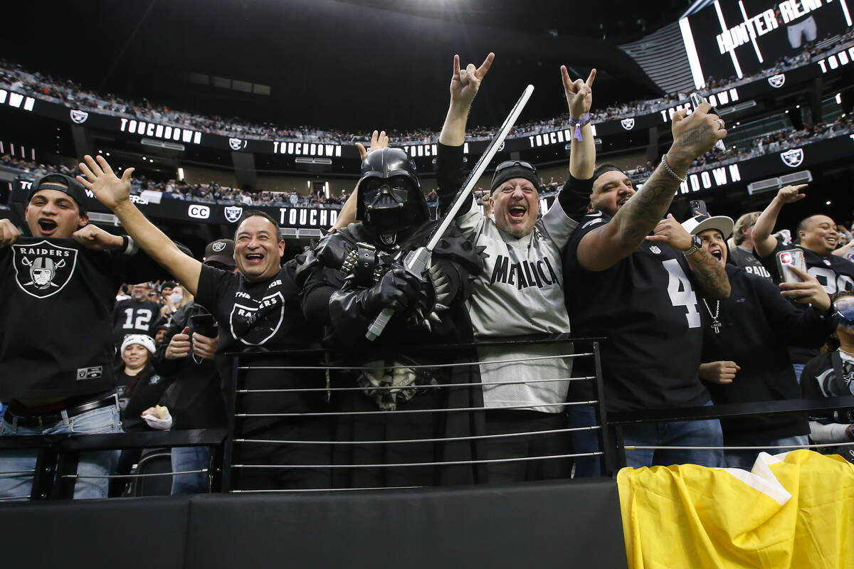Raiders fans celebrate a touchdown by Raiders wide receiver Hunter Renfrow, not pictured, durin ...
